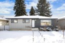 The property features a ranch-style exterior with a dark grey roof and light grey siding - 12823 81 Street, Edmonton, AB  - Outdoor 