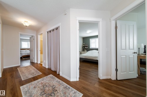 Hallway featuring wood-finish flooring and light neutral wall paint - 1205 Ormsby Lane, Edmonton, AB - Indoor Photo Showing Other Room