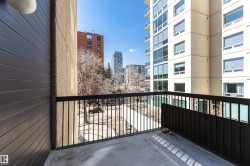 Concrete balcony with black metal railings - 
