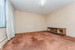 Spacious room with a large window and full-height drapery - 