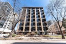 Multi-story building featuring a facade with dark window panels and light-colored vertical elements - 407 10045 118 Street, Edmonton, AB  - Outdoor With Facade 