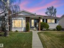 Ranch-style exterior featuring white siding and brick accents - 1027 77 Street, Edmonton, AB  - Outdoor 