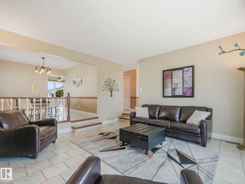 Tiled flooring throughout the main living area - 1027 77 Street, Edmonton, AB - Indoor Photo Showing Living Room