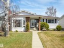 Ranch-style residence featuring white siding, brick accents, and a front walkway - 1027 77 Street, Edmonton, AB  - Outdoor With Facade 