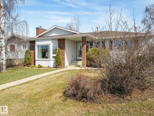 Single-story home featuring white siding and a prominent bay window - 1027 77 Street, Edmonton, AB - Outdoor