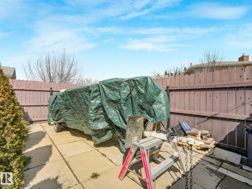 Private fenced yard featuring a concrete paver patio - 1027 77 Street, Edmonton, AB - Outdoor