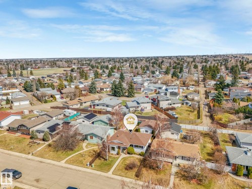 Aerial perspective showcasing a residential neighborhood with a variety of single-story and multi-story homes - 1027 77 Street, Edmonton, AB - Outdoor With View