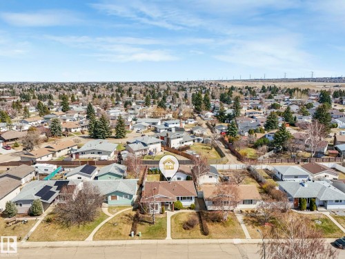 Aerial perspective showcasing a residential neighborhood with a variety of housing styles - 1027 77 Street, Edmonton, AB - Outdoor With View