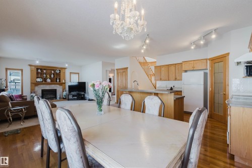 8608 160A Avenue, Edmonton, AB - Indoor Photo Showing Dining Room With Fireplace