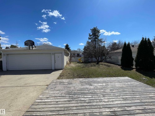 Detached two-car garage with a single side entry door and a pitched shingle roof - 10519 36A Avenue, Edmonton, AB - Outdoor