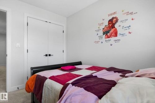 Light gray wall with white trim and carpeting - 3605 42 Avenue, Beaumont, AB - Indoor Photo Showing Bedroom
