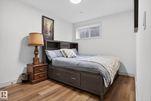 Bedroom featuring wood-finish flooring and neutral wall tones - 3605 42 Avenue, Beaumont, AB - Indoor Photo Showing Bedroom