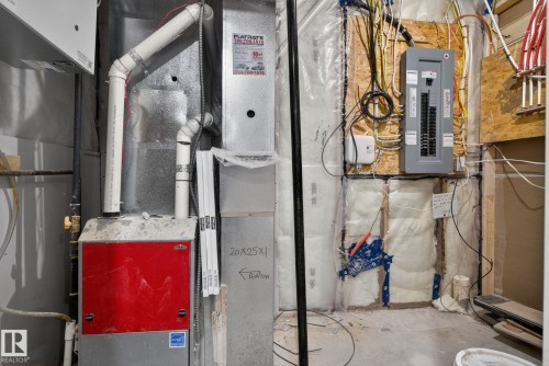 HVAC system with visible ductwork, electrical panel, and insulation - 3605 42 Avenue, Beaumont, AB - Indoor Photo Showing Basement
