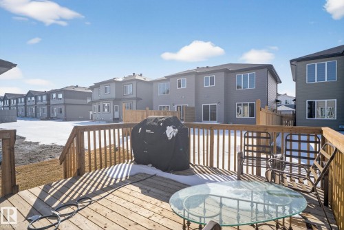 Spacious wooden deck with a slatted railing, providing an outdoor living area - 3605 42 Avenue, Beaumont, AB - Outdoor With Deck Patio Veranda With Exterior