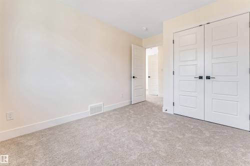 Neutral-toned wall finishes throughout - 10323 79 Street, Edmonton, AB - Indoor Photo Showing Other Room