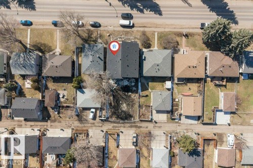 Aerial perspective showcasing a residential property with a dark shingle roof and a backyard space - 10323 79 Street, Edmonton, AB - Outdoor With View