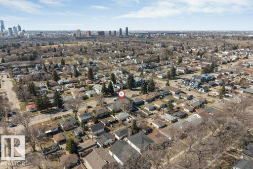 Aerial overview of a residential area featuring numerous detached homes with pitched roofs - 10323 79 Street, Edmonton, AB - Outdoor With View