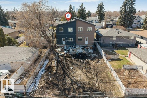 New construction duplex featuring dark blue and beige siding - 10323 79 Street, Edmonton, AB - Outdoor