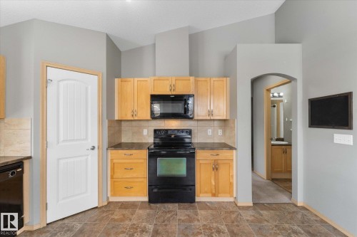 Built-in wire shelving system installed in a white-walled storage area, providing multiple levels of storage capacity - 86 604 62 Street, Edmonton, AB - Indoor With Storage