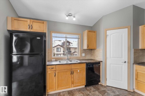Neutral grey walls complement light-colored carpeting - 86 604 62 Street, Edmonton, AB - Indoor Photo Showing Other Room