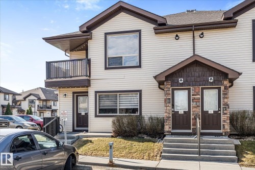 Multi-level townhome featuring vinyl siding and stone accents - 86 604 62 Street, Edmonton, AB - Outdoor With Facade