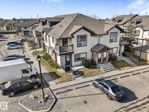 Two-story exterior featuring light-toned horizontal siding with dark brown trim accents - 86 604 62 Street, Edmonton, AB - Outdoor With Facade