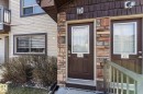 Kitchen featuring light wood cabinetry, black appliances, stone-look countertops, and tiled flooring - 86 604 62 Street, Edmonton, AB  - Indoor 