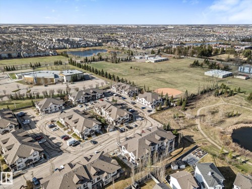 Aerial perspective showcasing a residential development with multiple low-rise apartment buildings featuring pitched roofs - 86 604 62 Street, Edmonton, AB - Outdoor With View