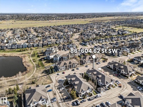Aerial perspective highlighting a residential development with multiple condominium buildings - 86 604 62 Street, Edmonton, AB - Outdoor With View