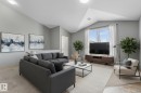 Spacious bedroom featuring light gray walls, plush carpet flooring, a large window with blinds, and recessed lighting - 86 604 62 Street, Edmonton, AB  - Indoor Photo Showing Bedroom 