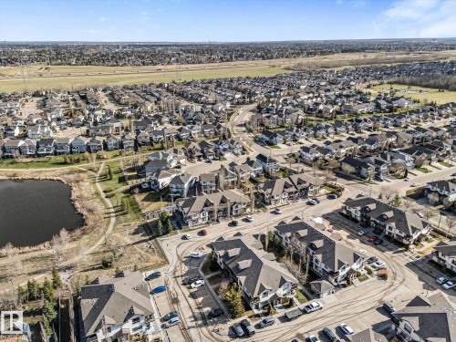 Aerial depiction of a residential community featuring townhomes and single-family residences - 86 604 62 Street, Edmonton, AB - Outdoor With View