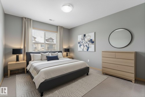 Entryway with a white door featuring integrated blinds and a light wood-finish trim - 86 604 62 Street, Edmonton, AB - Indoor Photo Showing Other Room