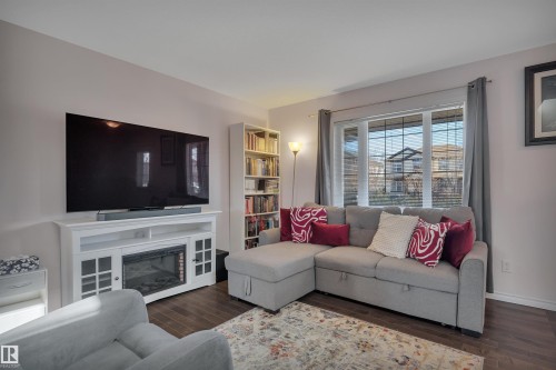 355 Secord Boulevard, Edmonton, AB - Indoor Photo Showing Living Room With Fireplace