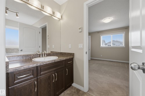 Ensuite 4-PC bath off the primary bedroom with in-floor heating. - 20813 96A Avenue, Edmonton, AB - Indoor Photo Showing Bathroom