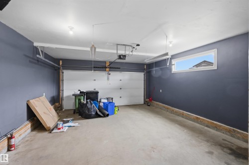 Double attached heated and insulated garage complete with an EV plug. - 20813 96A Avenue, Edmonton, AB - Indoor Photo Showing Garage