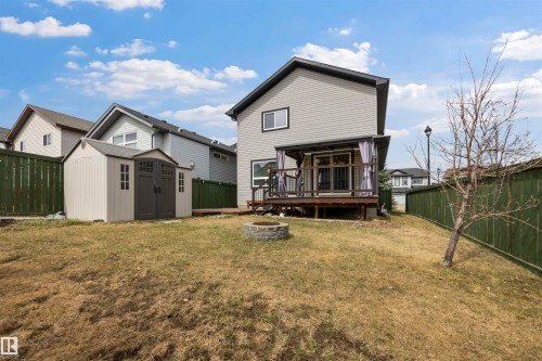 South-facing backyard complete with two-tier deck, natural gas hook-up, gazebo (staying), firepit and large shed (staying). - 20813 96A Avenue, Edmonton, AB - Outdoor With Deck Patio Veranda