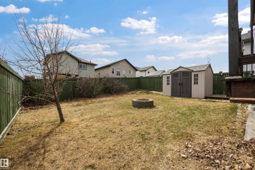 South-facing backyard complete with two-tier deck, natural gas hook-up, gazebo (staying), firepit and large shed (staying). - 20813 96A Avenue, Edmonton, AB - Outdoor