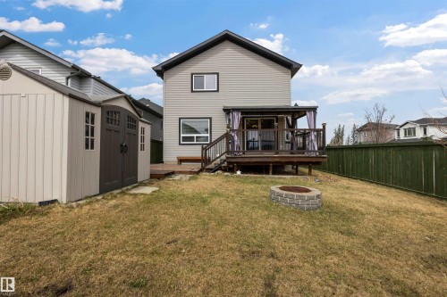 South-facing backyard complete with two-tier deck, natural gas hook-up, gazebo (staying), firepit and large shed (staying). - 20813 96A Avenue, Edmonton, AB - Outdoor With Deck Patio Veranda