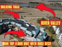 Multi-story residential building featuring a prominent rooftop deck and private balconies - 410 9926 100 Avenue, Fort Saskatchewan, AB  - Other 