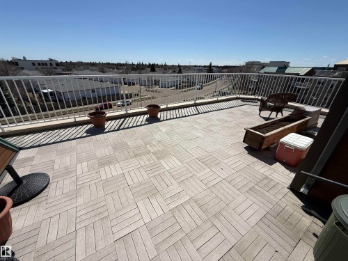 Expansive outdoor terrace featuring modular wood-finish flooring - 410 9926 100 Avenue, Fort Saskatchewan, AB - Outdoor