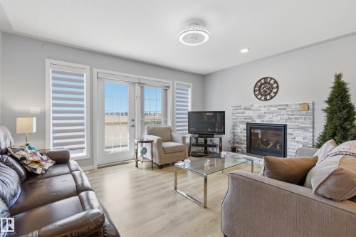 295 Youville Drive E, Edmonton, AB - Indoor Photo Showing Living Room With Fireplace