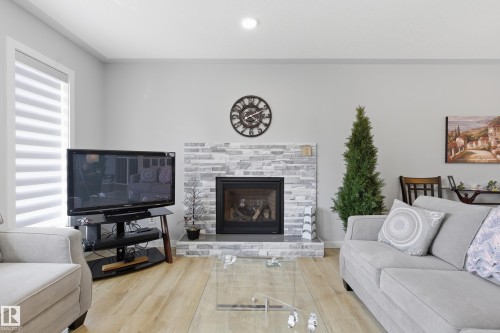 295 Youville Drive E, Edmonton, AB - Indoor Photo Showing Living Room With Fireplace