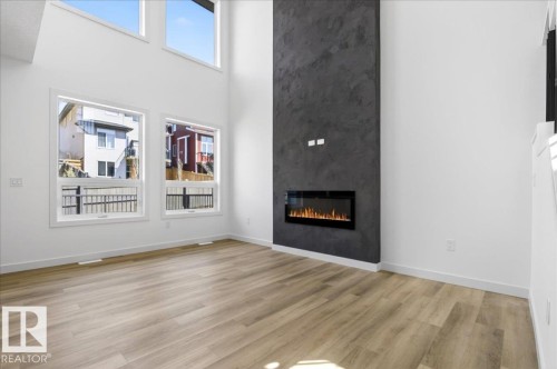 1150 Gyrfalcon Crescent, Edmonton, AB - Indoor Photo Showing Living Room With Fireplace