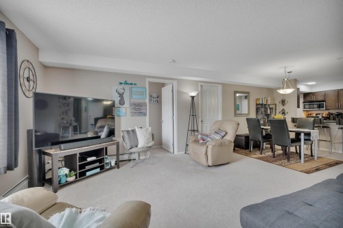 208 11820 22 Avenue, Edmonton, AB - Indoor Photo Showing Living Room