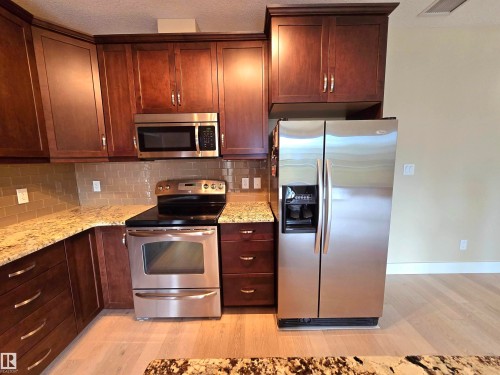 256 6079 Maynard Way, Edmonton, AB - Indoor Photo Showing Kitchen With Stainless Steel Kitchen