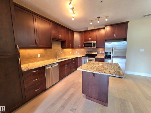 256 6079 Maynard Way, Edmonton, AB - Indoor Photo Showing Kitchen With Stainless Steel Kitchen