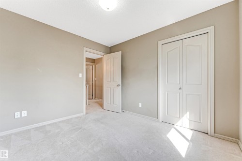 Bright room with neutral wall tones and light-colored carpeting - 1431 Hodgson Way, Edmonton, AB - Indoor Photo Showing Other Room