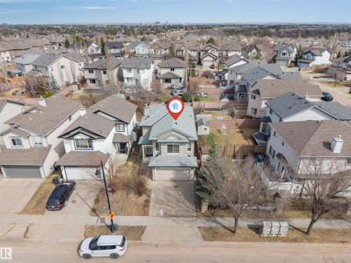Two-story residence featuring a front-facing garage with driveway parking - 1431 Hodgson Way, Edmonton, AB - Outdoor