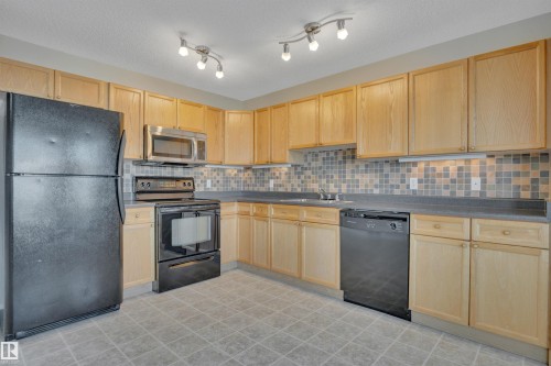 15 Southwick Point, Leduc, AB - Indoor Photo Showing Kitchen With Double Sink