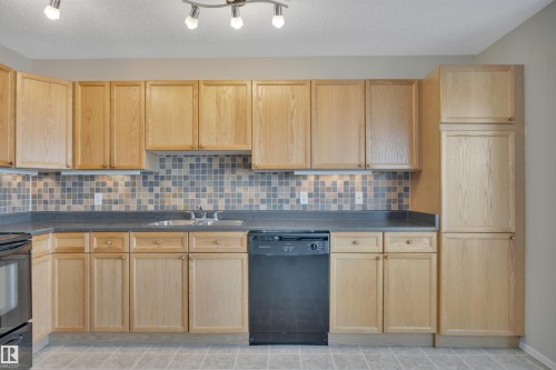 15 Southwick Point, Leduc, AB - Indoor Photo Showing Kitchen With Double Sink
